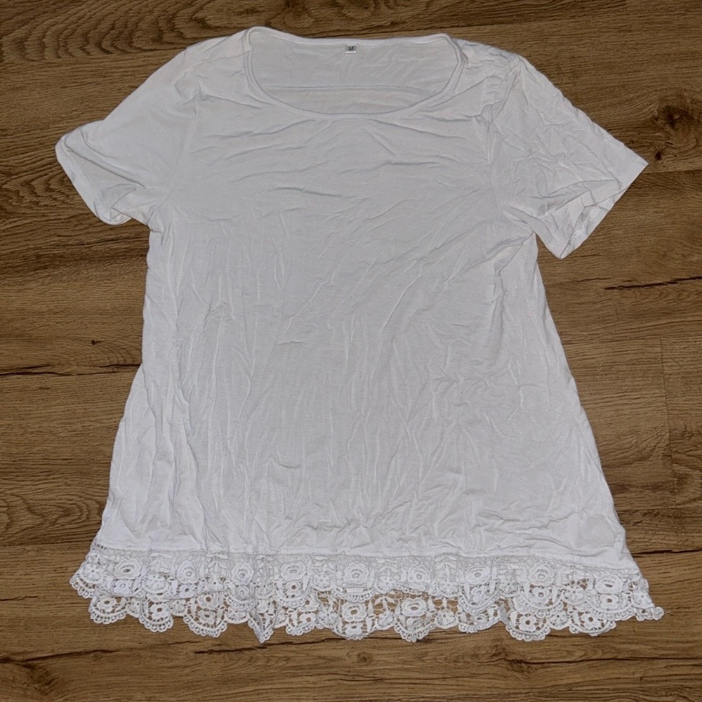 Women’s unbranded size medium white with Lacey crotchet style hem